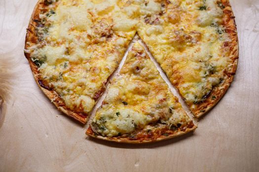Home cooked pizza on a wooden board
