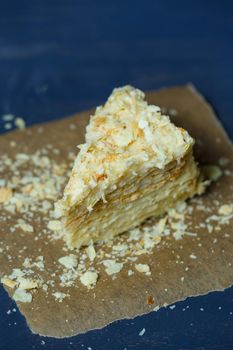 homemade Napoleon cake with cream on a gray background