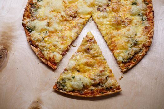 Home cooked pizza on a wooden board