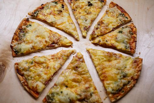 Home cooked pizza on a wooden board