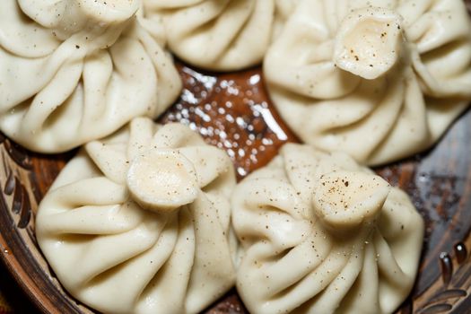 Georgian national dish Khinkali. Laid on a clay plate
