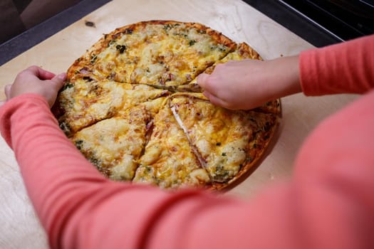Home cooked pizza on a wooden board