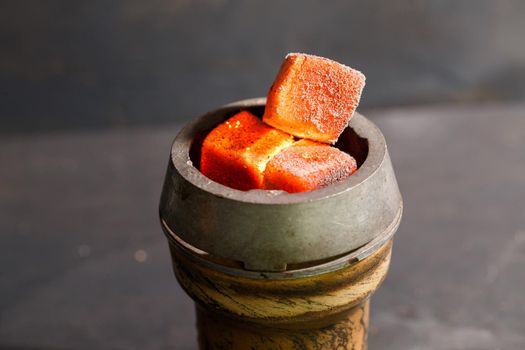 roasted coals in a clay bowl for a hookah