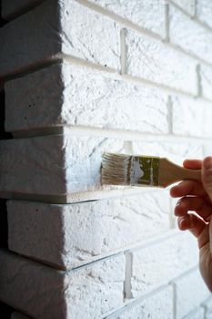 painting plaster decorative brick with white paint