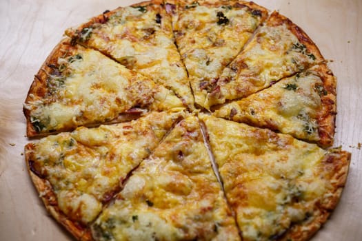 Home cooked pizza on a wooden board