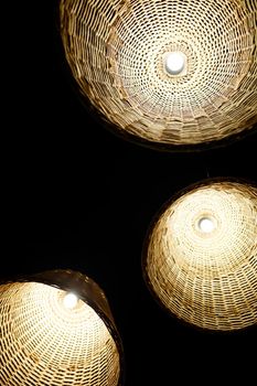 large wooden chandeliers with bulbs in the interior