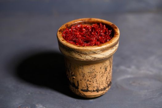 Tobacco for hookah in a clay bowl