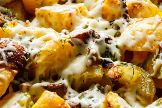 Baked potatoes with mushrooms and cheese with seasonings and herbs