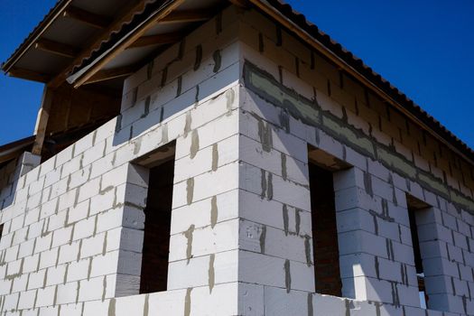 construction of a country two-story house from a gas block