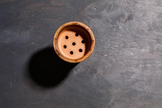 Hookah bowl without tobacco on a gray background
