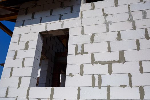construction of a country two-story house from a gas block