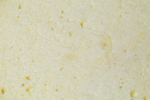 Freshly baked sponge cake with a golden brown crust.