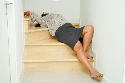 Asian lady woman injuries from falling down on slippery surfaces stairs at home.