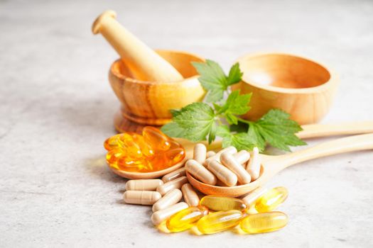 Alternative medicine herbal organic capsule with vitamin E omega 3 fish oil, mineral, drug with herbs leaf natural supplements for healthy good life.