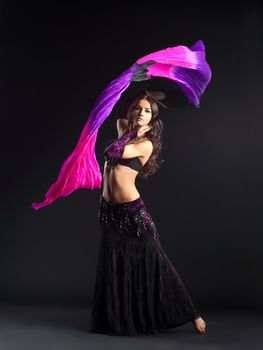 beauty girl posing in traditional arabian costume with fantail