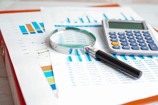 Calculator on chart and graph spreadsheet paper. Finance development, Banking Account, Statistics, Investment Analytic research data economy, Stock exchange trading, Business company concept.
