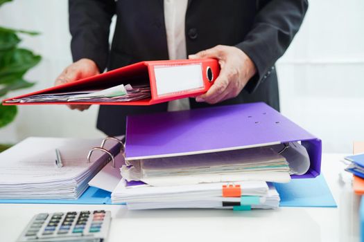 Business woman busy working with documents in office.