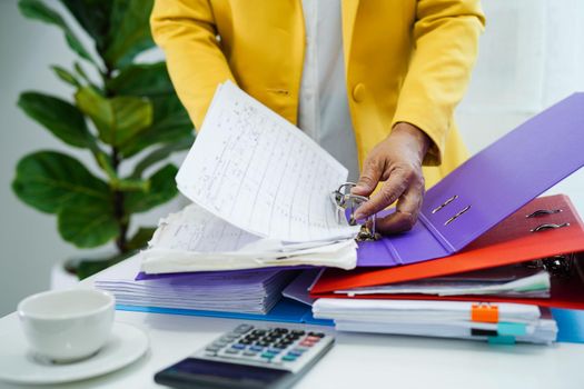 Business woman busy working with documents in office.