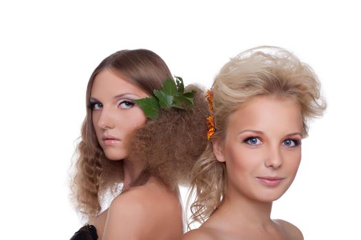 Two beautiful young women with season flower hair style