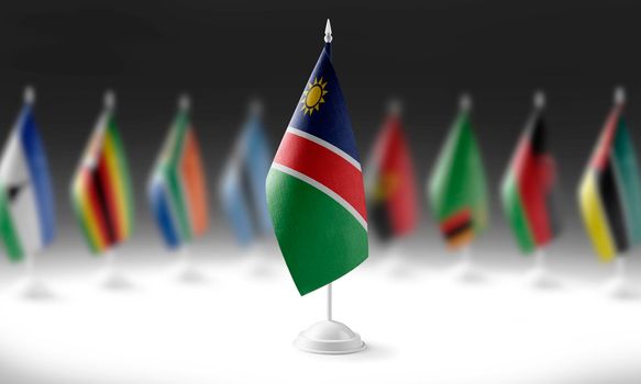 The national flag of the Namibia on the background of flags of other countries.