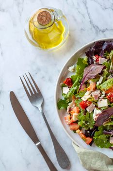 portion of bacon, tomato, cheese and bell pepper salad, top view