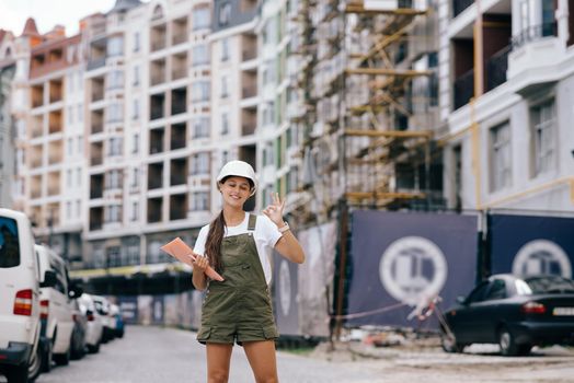 Woman construction engineer wear safety white hard hat at construction site industry worker. Woman construction Engineer concept