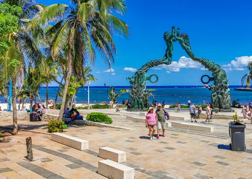 Playa del Carmen Mexico 14. May 2022 The ancient architecture of the Portal Maya in the Fundadores park with blue sky and turquoise seascape and beach panorama in Playa del Carmen Quintana Roo Mexico.