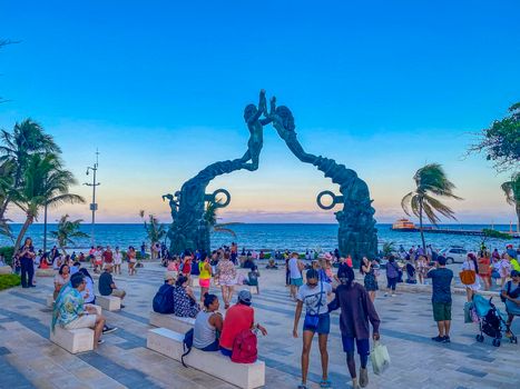 Playa del Carmen Mexico 12. May 2022 The ancient architecture of the Portal Maya in the Fundadores park with blue sky and turquoise seascape and beach panorama in Playa del Carmen Quintana Roo Mexico.