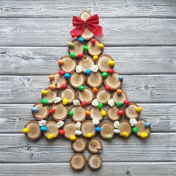 The Christmas tree is lined with small wood cuts and decorated with caramel. High quality photo