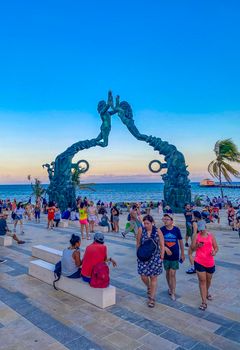 Playa del Carmen Mexico 12. May 2022 The ancient architecture of the Portal Maya in the Fundadores park with blue sky and turquoise seascape and beach panorama in Playa del Carmen Quintana Roo Mexico.