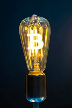 Money making idea. Light bulb with Bitcoin symbol.