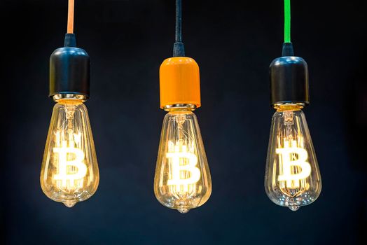 Money making idea. Light bulb with Bitcoin symbol.