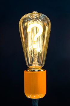 Bulb with glowing question mark inside of it, creativity concept