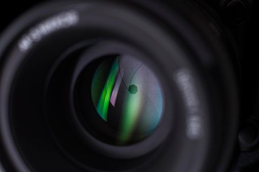 Camera lens close-up on white background