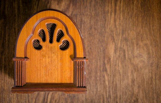 Retro radio on old wooden table table. close-up.