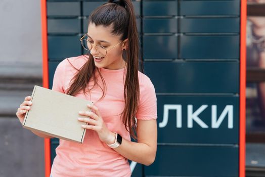 Young woman preparing parcel for shipment to client