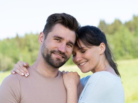 Portrait of mid adult happy smiling couple at countryside