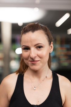 Portrait of a female trainee posing for the camera at the crossfit box