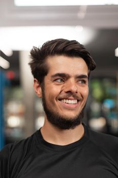 Portrait of a male coach posing for the camera at the crossfit box