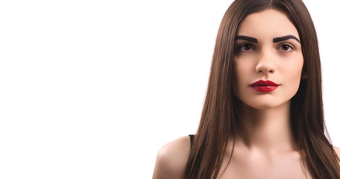 Portrait of nice young gorgeous woman on white backgrounds. To a lots of copy space.