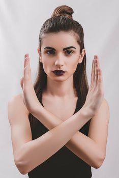 Portrait of nice young gorgeous woman on gray solid backgrounds.