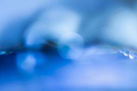 Blue bokeh. Abstract background. Defocused lights.