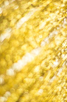 Gold bokeh. Abstract background. Defocused lights.