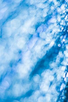 Blue bokeh. Abstract background. Defocused lights.