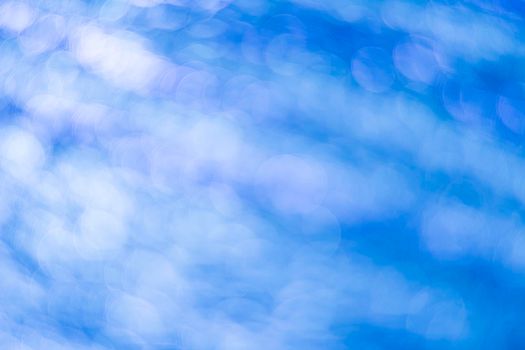 Blue bokeh. Abstract background. Defocused lights.
