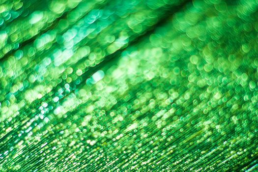 Green bokeh. Abstract background. Defocused lights.