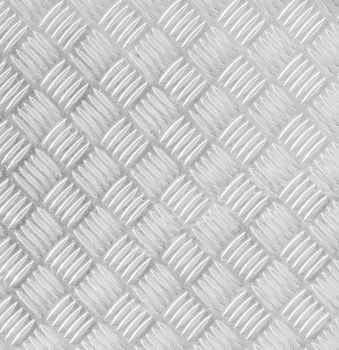 Metal floor plate with diamond pattern.