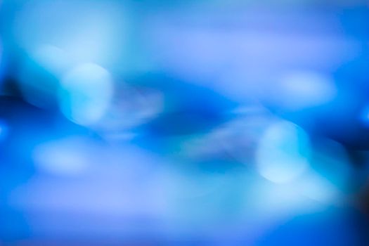 Blue bokeh. Abstract background. Defocused lights.