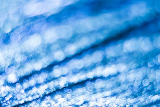 Blue bokeh. Abstract background. Defocused lights.