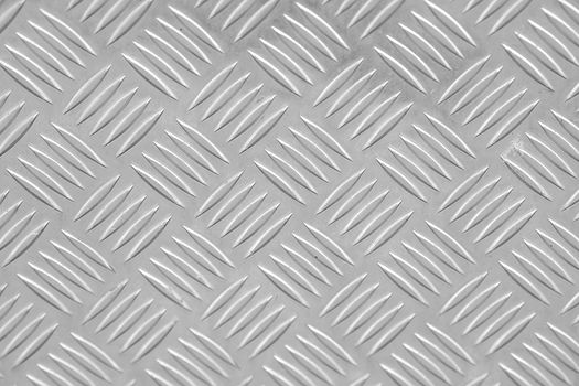 Metal floor plate with diamond pattern.